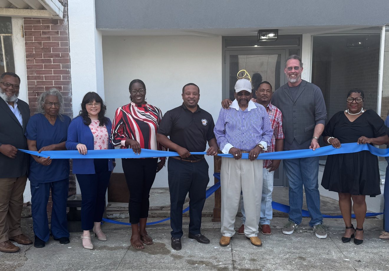 Blue ribbon cutting ceremony at 204 Louisiana Avenue with owners Carlos Brown and Curtis Brown Jr., Ferriday Downtown Commissioners, and the Mayor