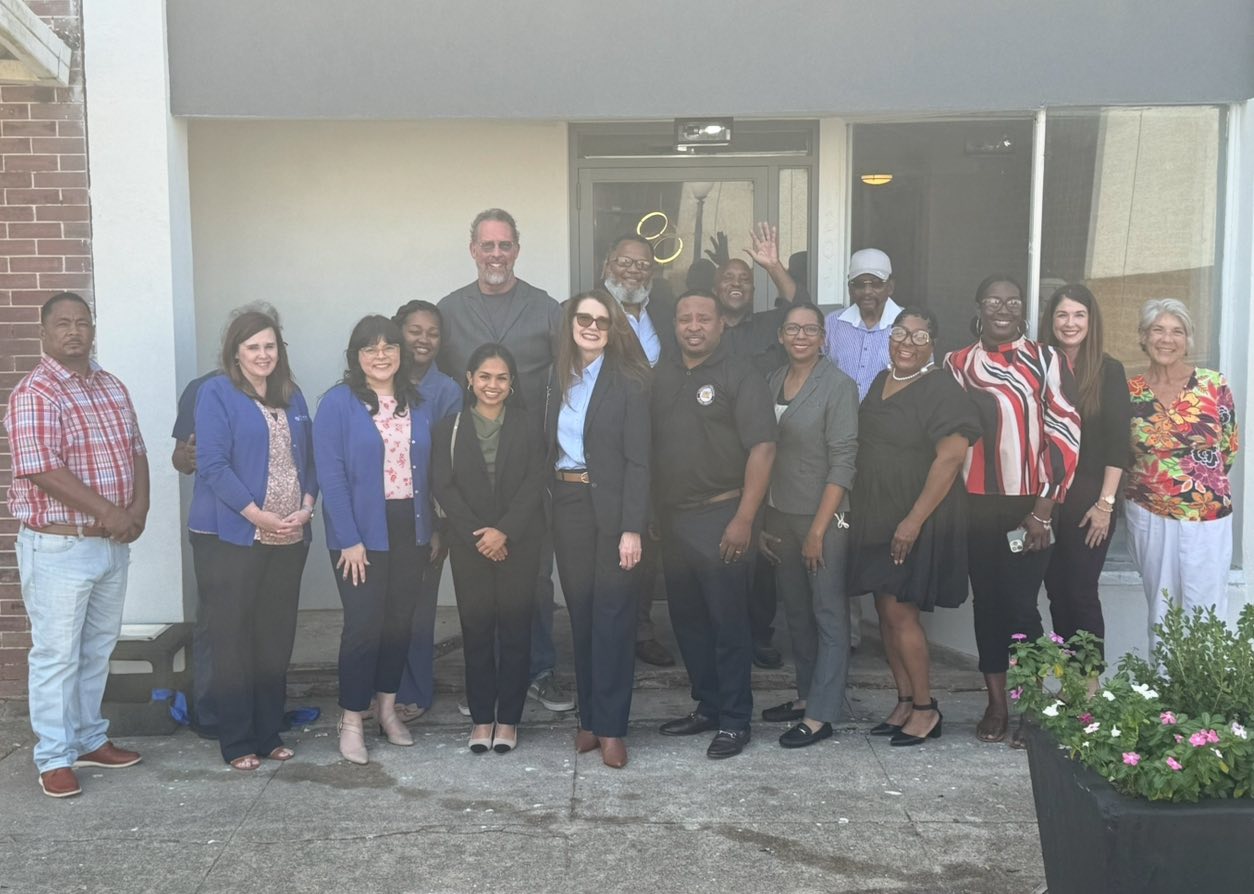 Group photo of attendees at the 204 Louisiana Avenue ribbon cutting ceremony